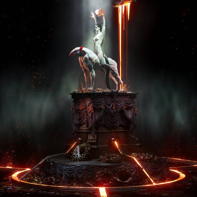 Statue of a woman with a bird on a dark background