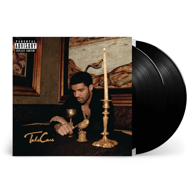 Vinyl record with a cover featuring a person in a dimly lit room with candles and a 'Parental Advisory' label.