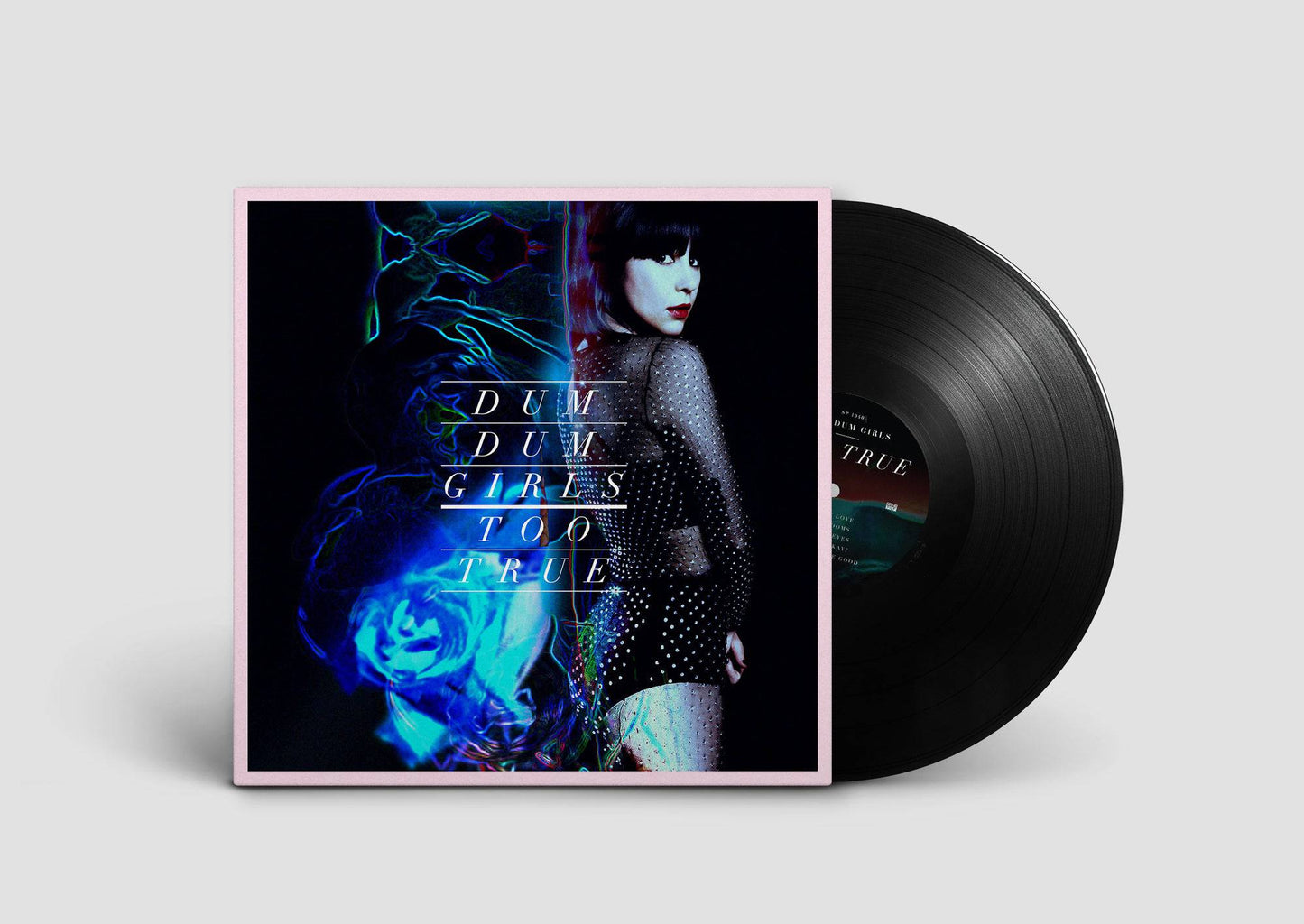 Vinyl record with cover featuring a stylized image of a woman and text on a light gray background