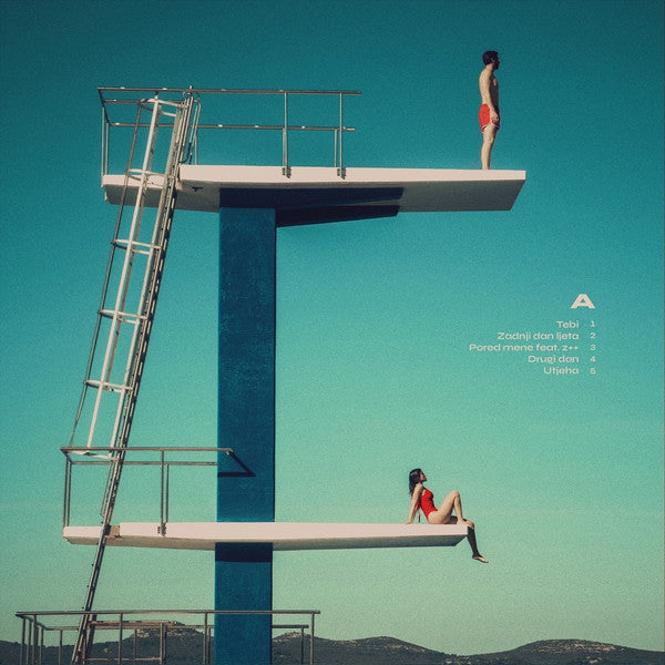 Two people on diving boards against a gradient blue sky.