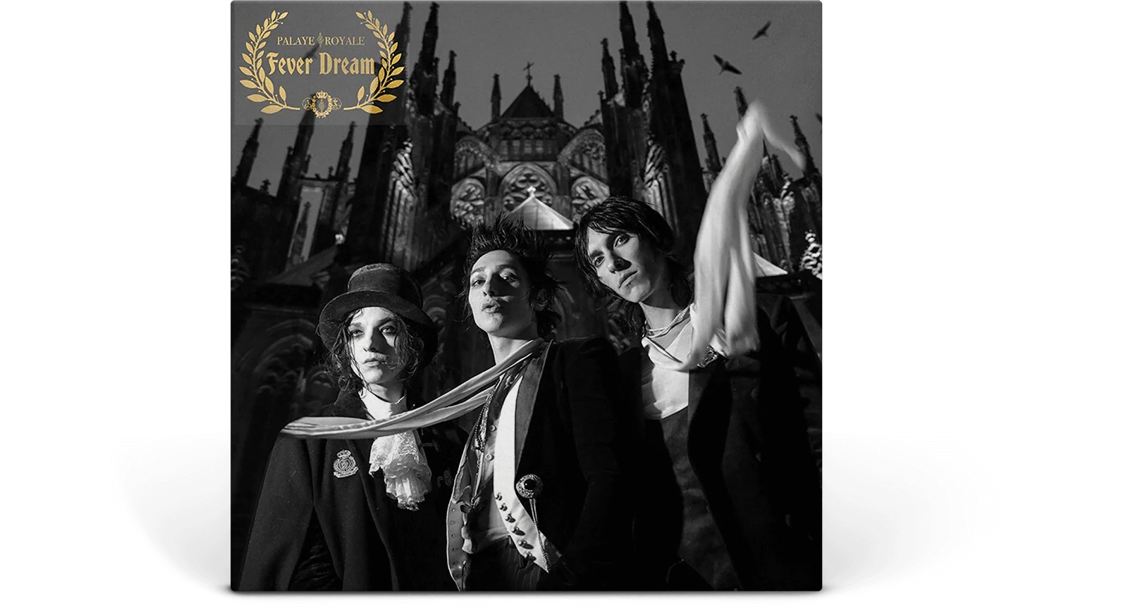 Album cover with three people in formal attire against a cityscape background, featuring the text 'Dream Theater' and 'Fever Dream'.