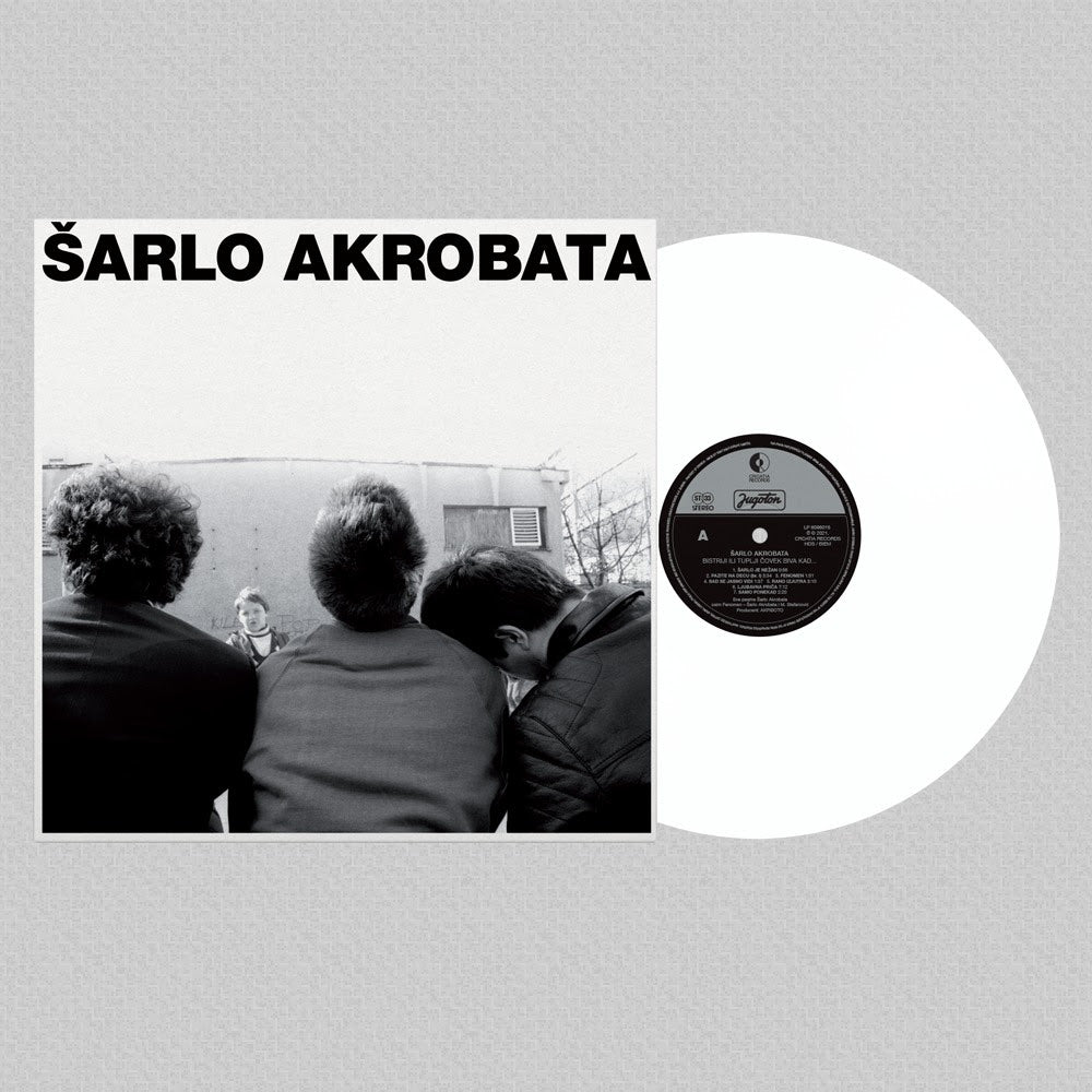 Vinyl record with cover featuring a black and white photo of people and text 'Sarlo Akrobata' on a gray background.