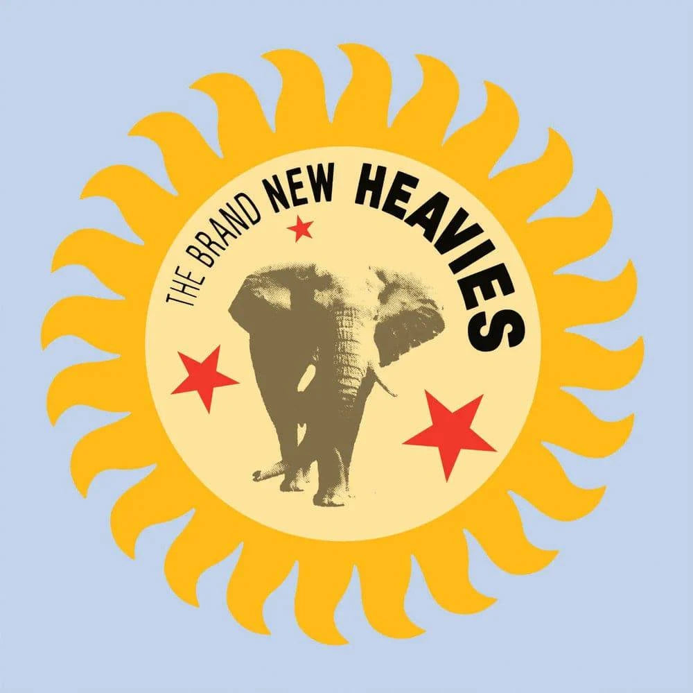 Logo of The Brand New Heavies with a yellow sun, elephant, and red stars on a light blue background