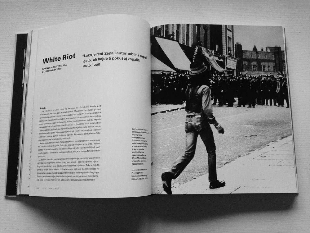 Open book with a black and white photograph of a person walking on a street, with text on a white background.